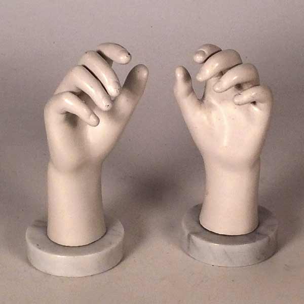 A pair of marble mounted mannequin hands.